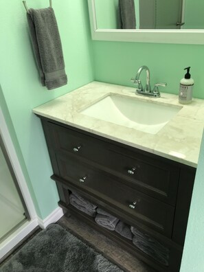 Shower, hair dryer, towels, soap