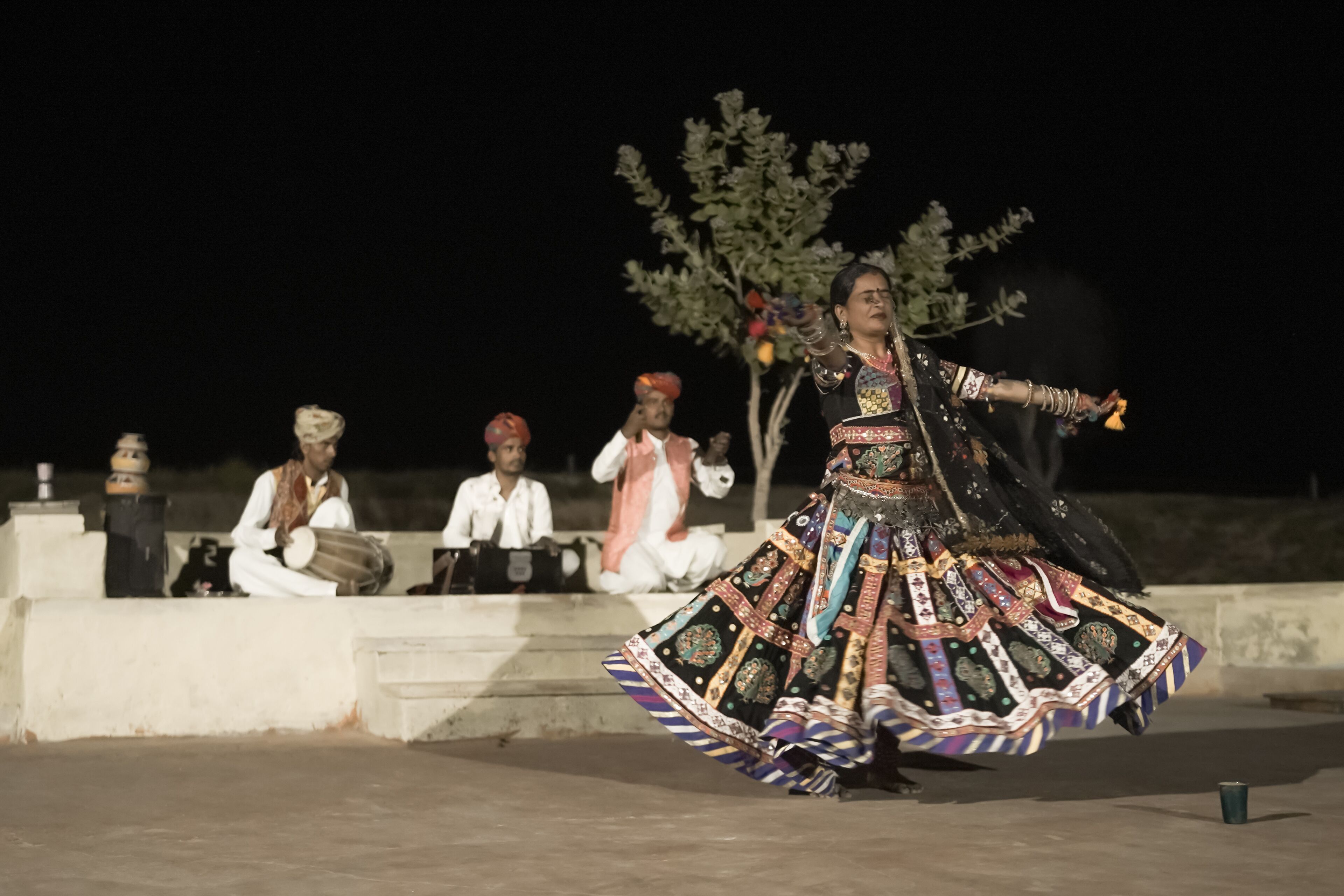 A person in traditional attire performing a dance.