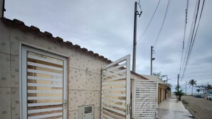 A building with a tiled floor and a metal gate.