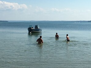 On the beach, sun-loungers, beach towels