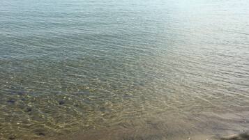On the beach, sun loungers, beach towels