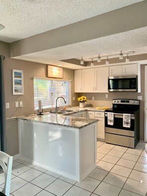 Fridge, microwave, oven, stovetop - Cozy cottage.New Port Richey.Private Heated Pool-solar panels. (NEW PORT RICHEY)