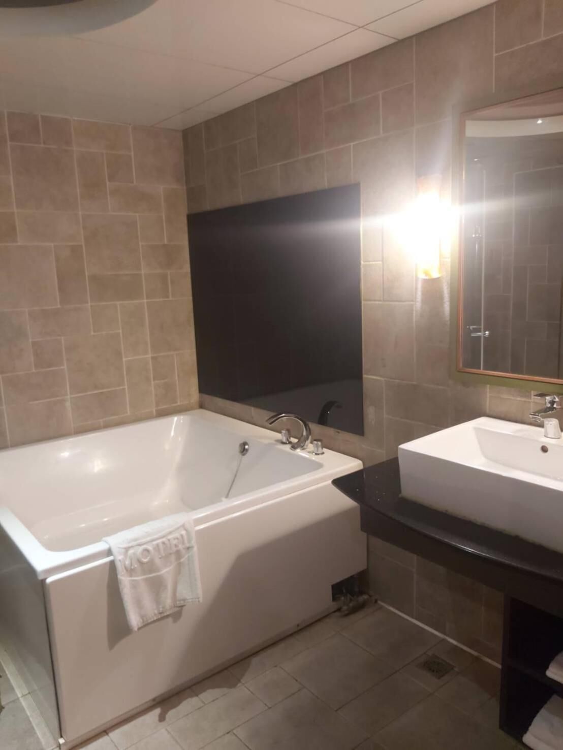 separate bathtub and shower, free toiletries, hair dryer, slippers