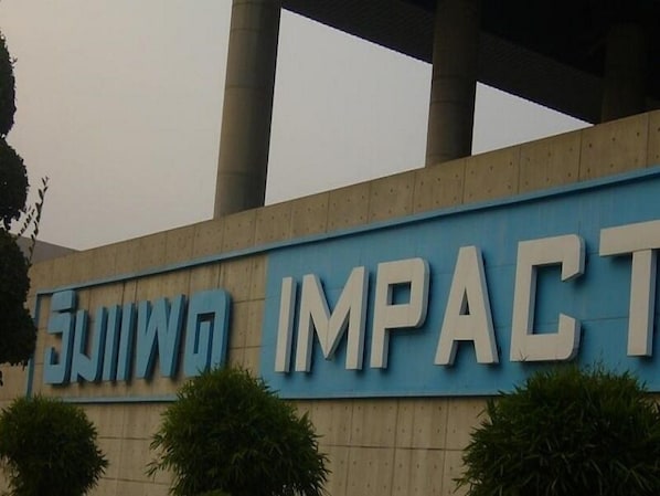 A building with a sign that reads "FUJIA IMPACT".
