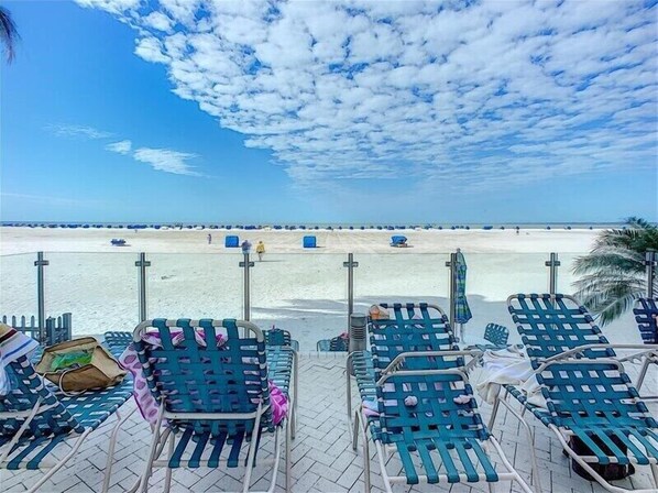 On the beach, sun loungers, beach towels