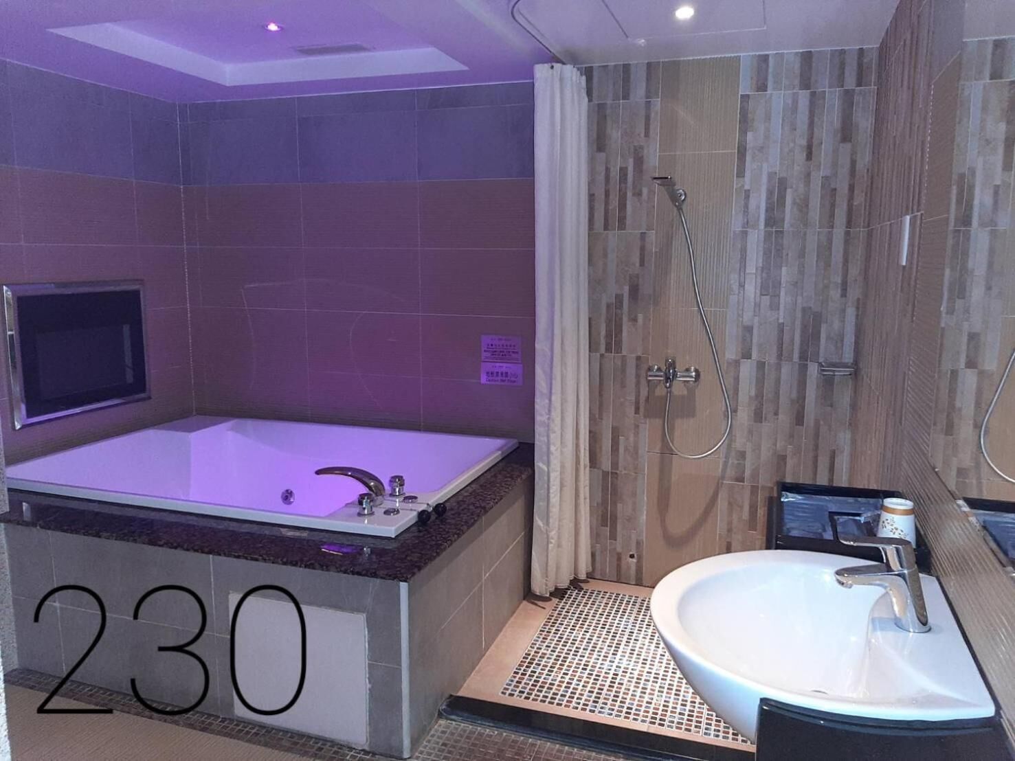 Separate bathtub and shower, free toiletries, hair dryer, slippers