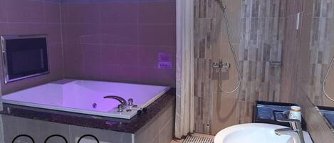 Separate tub and shower, free toiletries, hair dryer, slippers