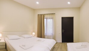 Standard Triple Room | Hypo-allergenic bedding, blackout drapes, free WiFi, bed sheets