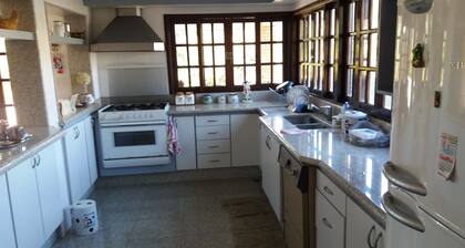 House in verdant paradise with golden lake, gated community