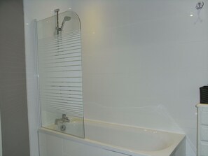 Combined shower/tub, hair dryer, towels, soap