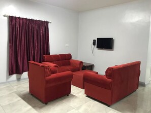 Appartement Confort (Lotus) | Coin séjour | TV connectée