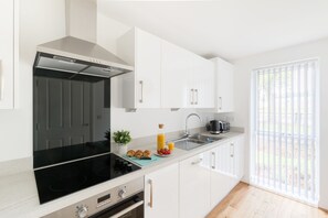 Fridge, microwave, oven, stovetop - Sherlock Modern Home by Svelte Living (Birmingham)