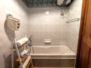 Bathtub, hair dryer, towels, soap