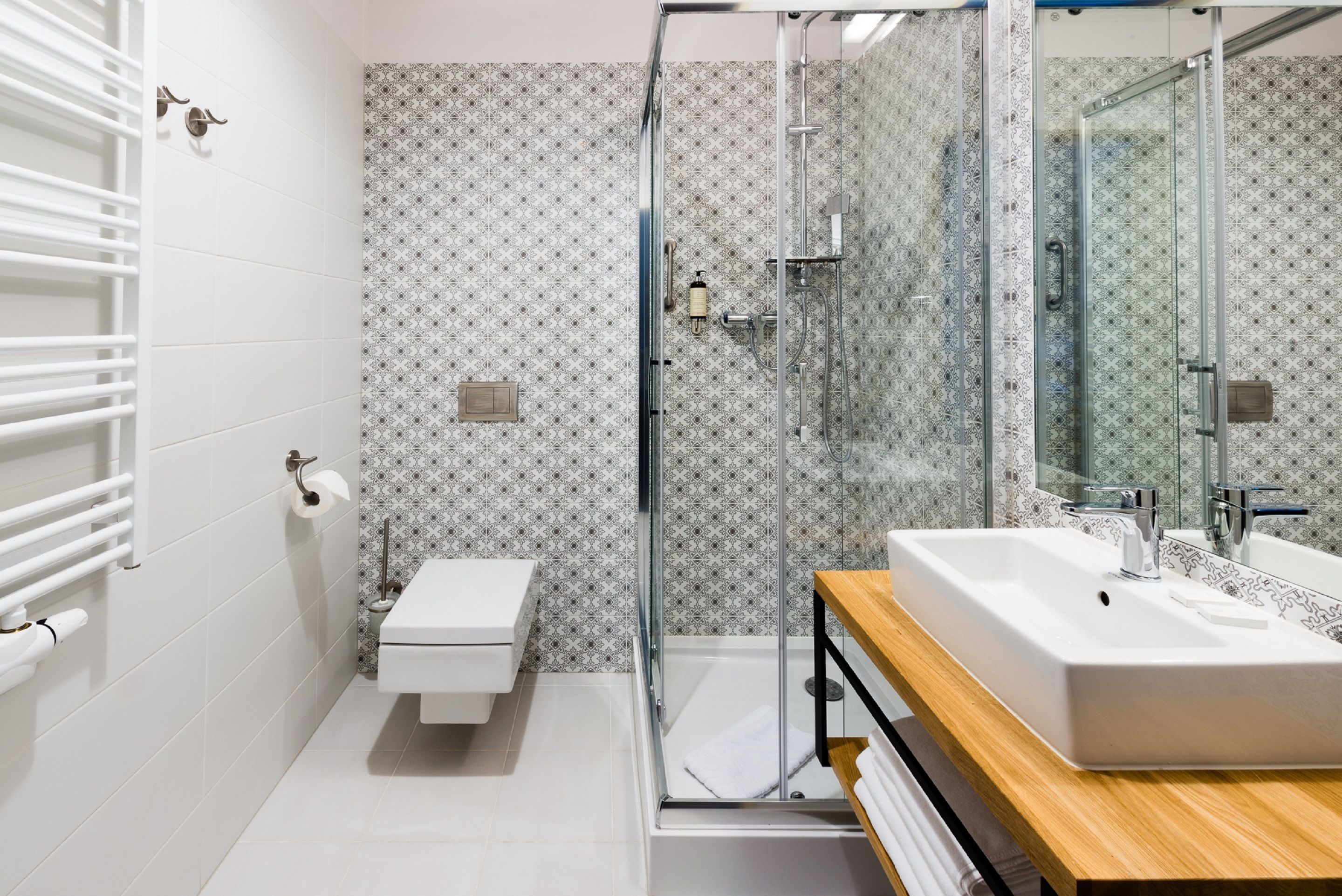 shower, rainfall showerhead, hair dryer, towels