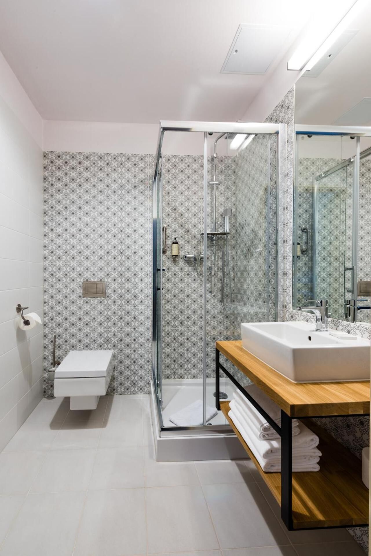 shower, rainfall showerhead, hair dryer, towels