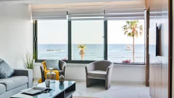 Luxury Apartment, Sea View | Living area | 43-inch flat-screen TV with cable channels, TV