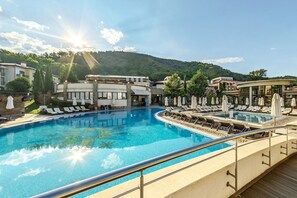 Indoor pool, seasonal outdoor pool, pool umbrellas, pool loungers