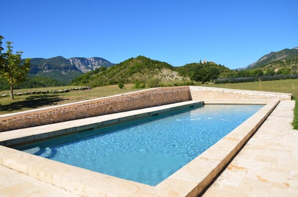 Seasonal outdoor pool, pool loungers