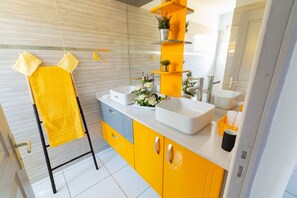 Shower, hair dryer, towels, toilet paper