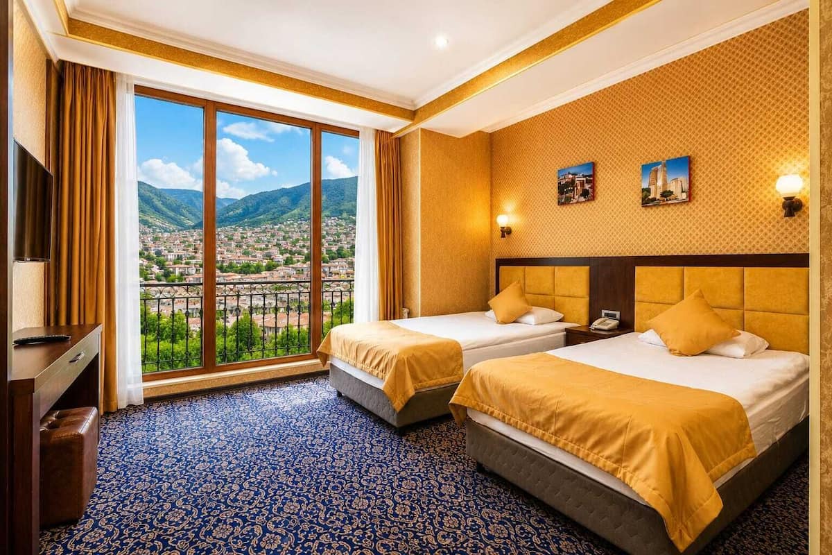 Standard Twin Room | Minibar, in-room safe, soundproofing, iron/ironing board