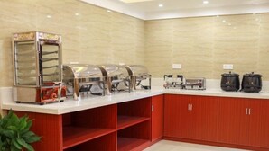 A buffet setup with a self-service food station, a coffee machine, and a microwave. - GreenTree Alliance Suzhou Sports Center Xihuan Rd Hotel (Suzhou)