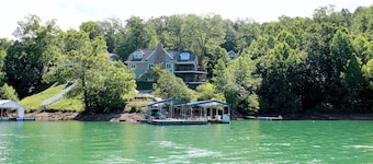 Huge Lakeside Lodge has stunning views and an easy walk to its big dock!