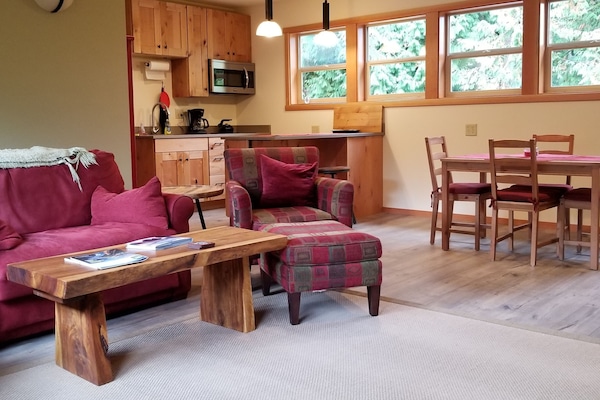 Living room, dining table, and kitchen.