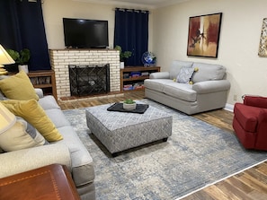Smart TV, fireplace, DVD player, books