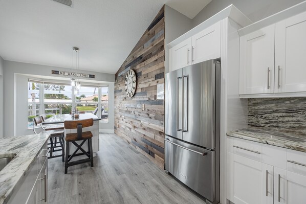 Fridge, microwave, oven, stovetop - Lovely waterfront gulf access, heated pool in SW Cape Coral awaits you. (Cape Coral)