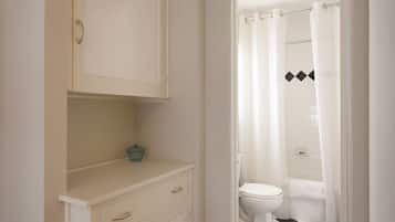 Bathtub, hair dryer, towels