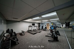 A gym with treadmills, weight machines, and exercise balls. - Upscale Perfection!  Beachfront Condo, End Unit  w/740 SqFt   Balcony!   Pool (panama city beach)