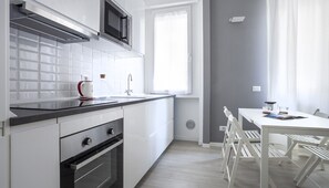 Apartment (1 Bedroom) | Private kitchen | Fridge, microwave, oven, stovetop