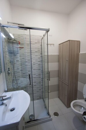 Shower, free toiletries, hair dryer, bathrobes