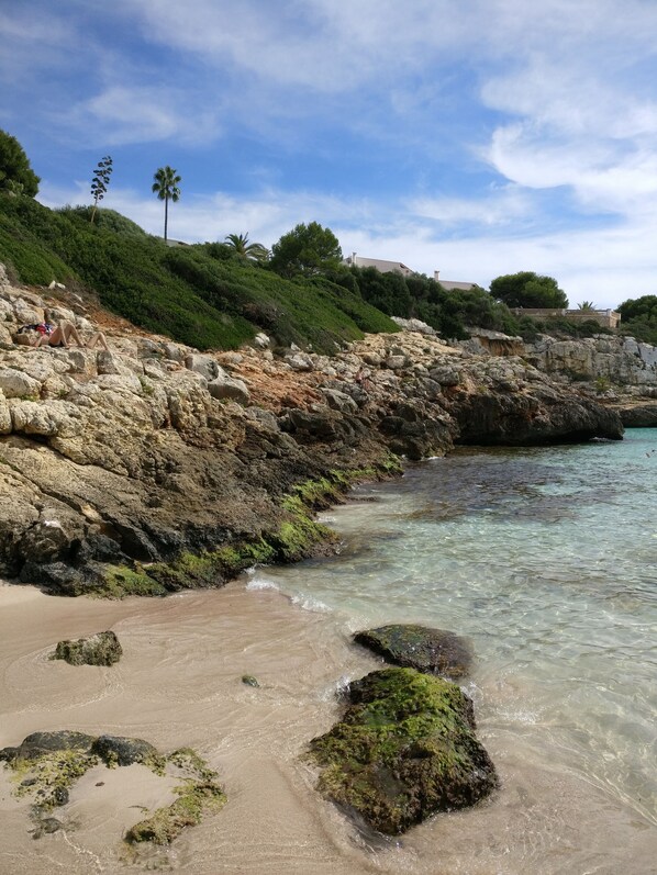 On the beach, sun-loungers