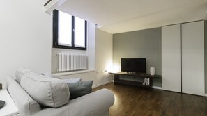 Lägenhet Comfort | Vardagsrum | 55-tums LCD-tv med satellitkanaler och tv