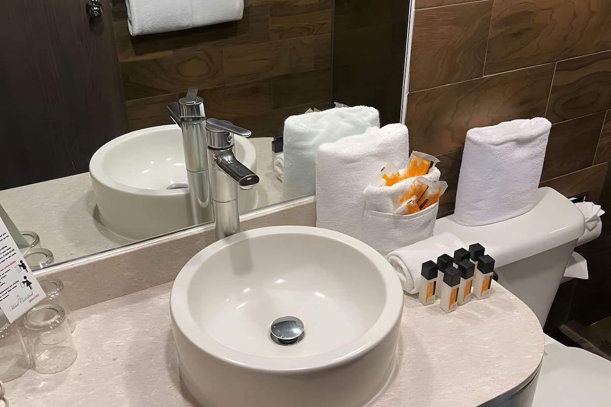 family triple room | bathroom | hair dryer, towels, soap, shampoo