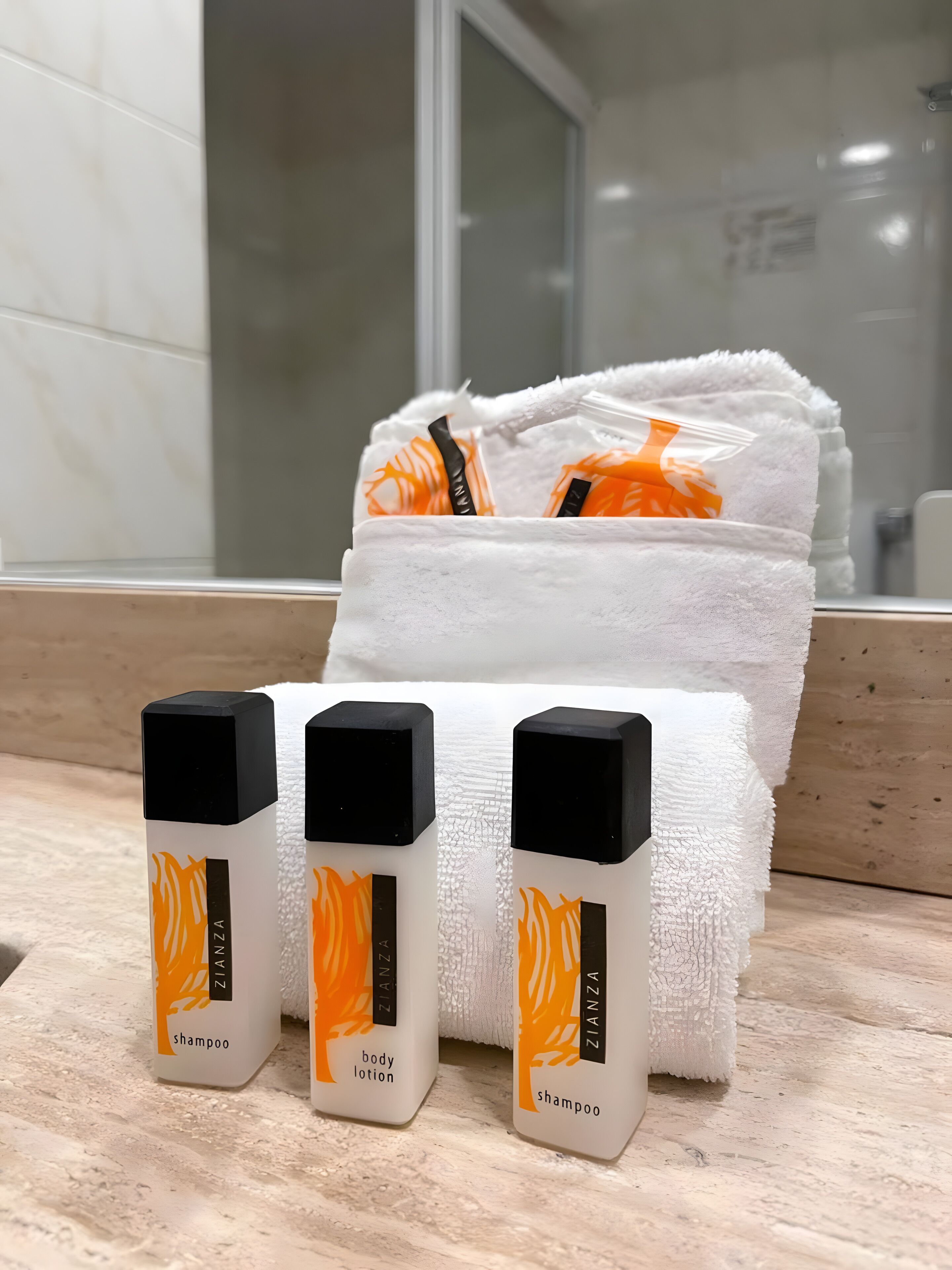 hair dryer, towels, soap, shampoo