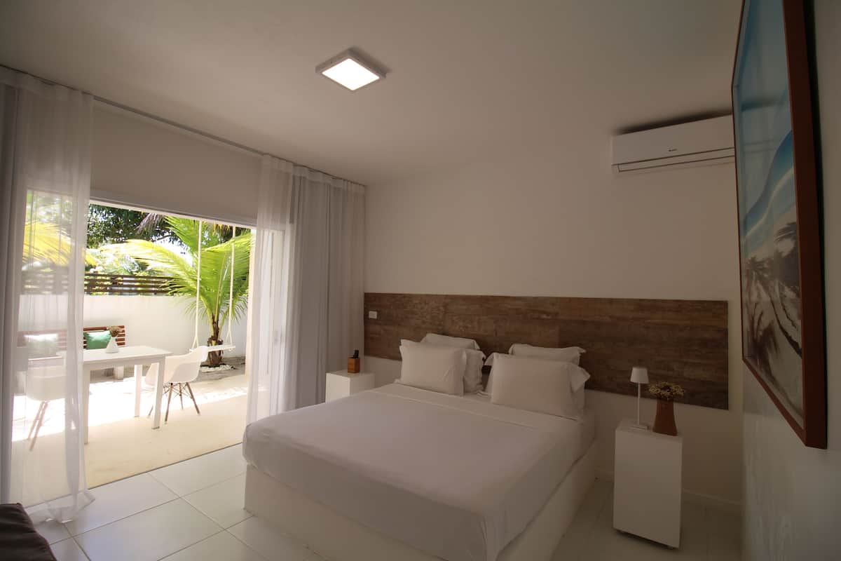 Standard Suite, 1 King Bed, Garden View | Premium bedding, pillowtop beds, minibar, blackout drapes