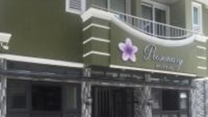 A building with a sign that reads "Rosemary Inn." - Rosemary Boutique (Maafushi)