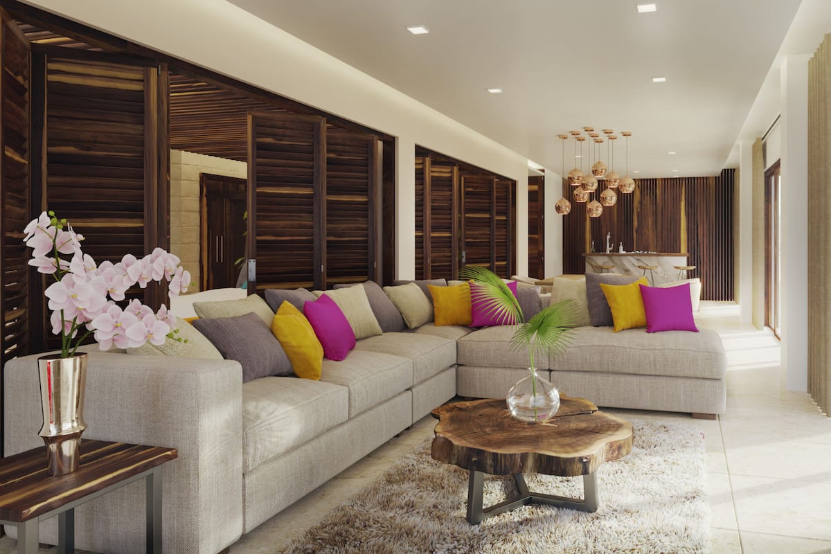 A modern living room with a sectional sofa, a wooden coffee table, and a large window with curtains.