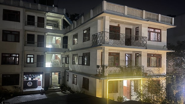 A multi-story building with balconies and a staircase. - Nirvaan Guest House (Kathmandu)
