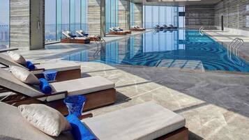 Indoor pool, open 6:30 AM to 11:00 PM, pool loungers