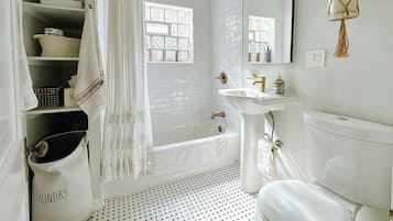 Combined shower/bathtub, hair dryer, towels, soap