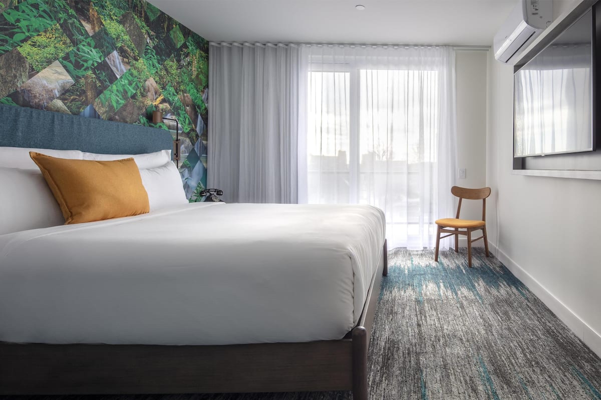 Suite, 1 King Bed, Balcony | In-room safe, desk, free WiFi, bed sheets