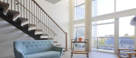Suite, 1 King Bed, Balcony | Living area | 55-inch flat-screen TV with cable channels, TV