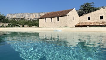 Seasonal outdoor pool, pool umbrellas, sun loungers