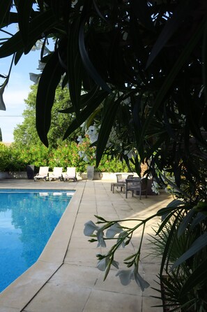 Seasonal outdoor pool, pool loungers