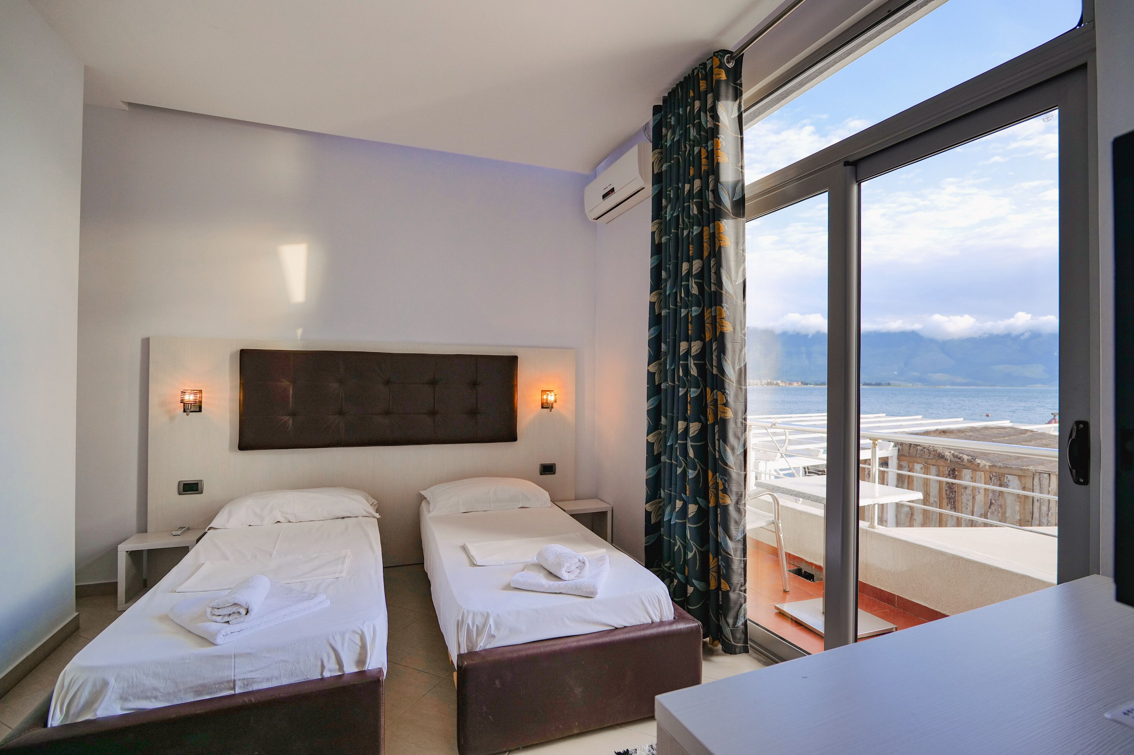 Twin Room, Sea View | Minibar, in-room safe, desk, free WiFi