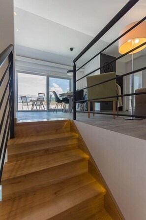 Apartment, Sea View | Living area | Flat-screen TV