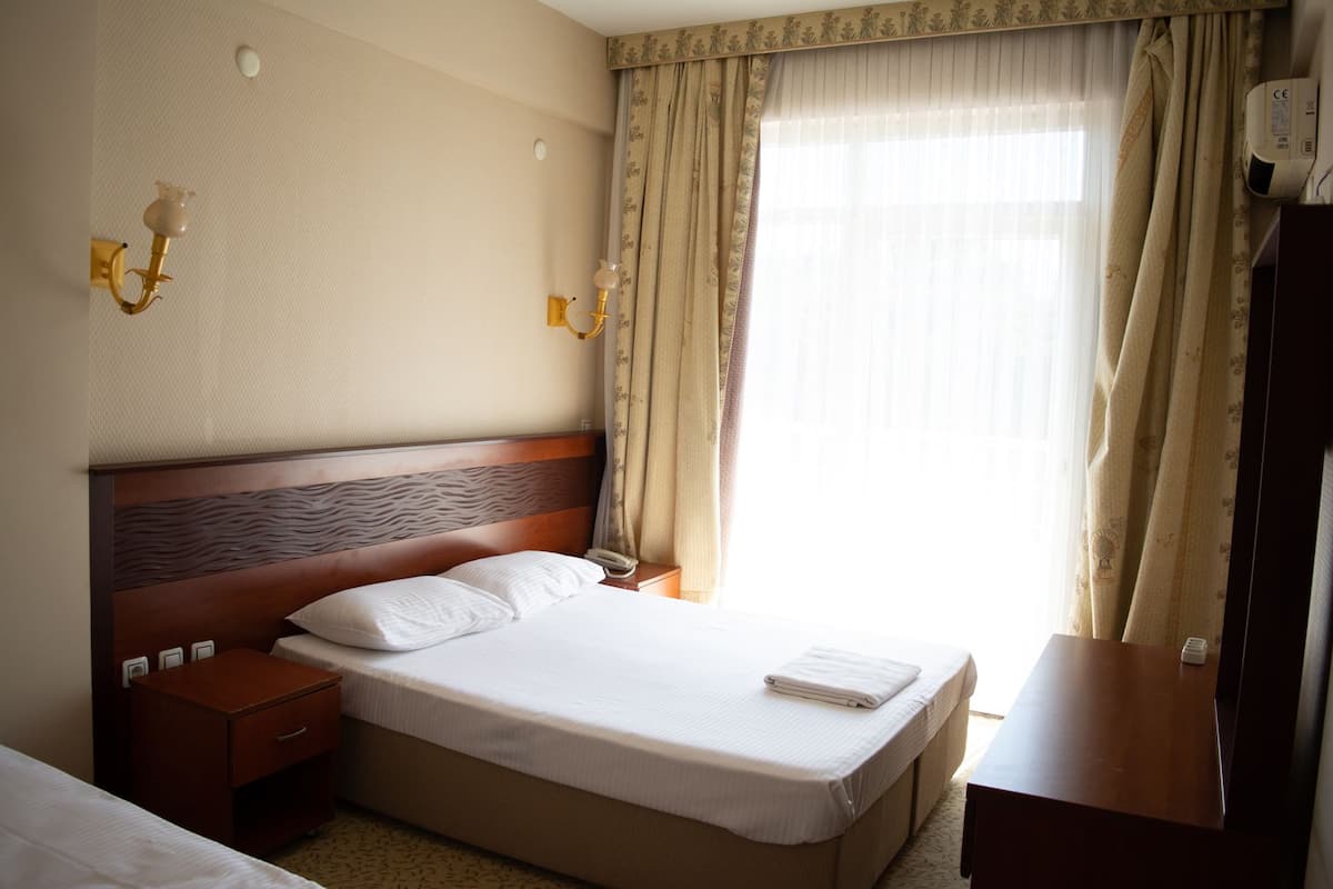 Desk, laptop workspace, blackout curtains, free WiFi